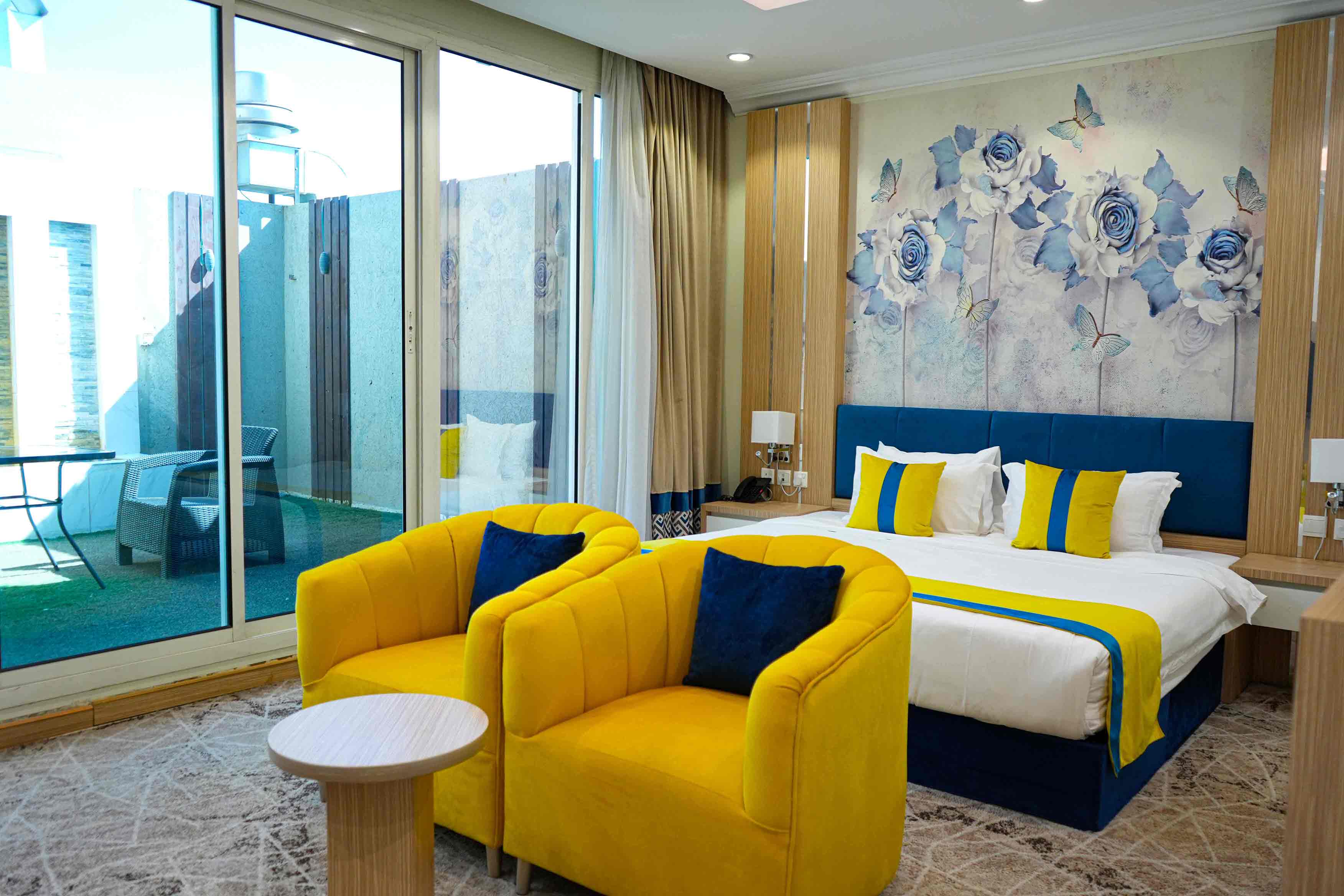 A spacious, luxurious suite with a bedroom and lounge area—perfect for long stays or families.